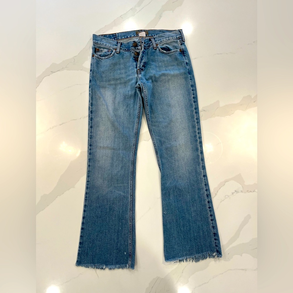 Hollister women’s size 11 button up jeans with fringe bottoms.